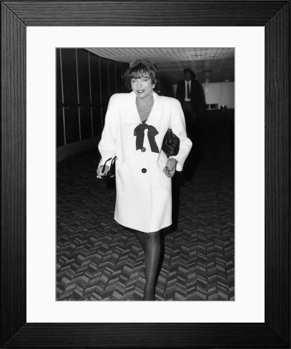 Framed Print : Joan Collins actress starred in Dynasty arrives Heathrow Airport, March 1988