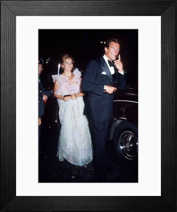 Framed Print : British actor Roger Moore with his wife at the Premiere Live Framed Print : British actor Roger Moore with his wife at the Premiere Live