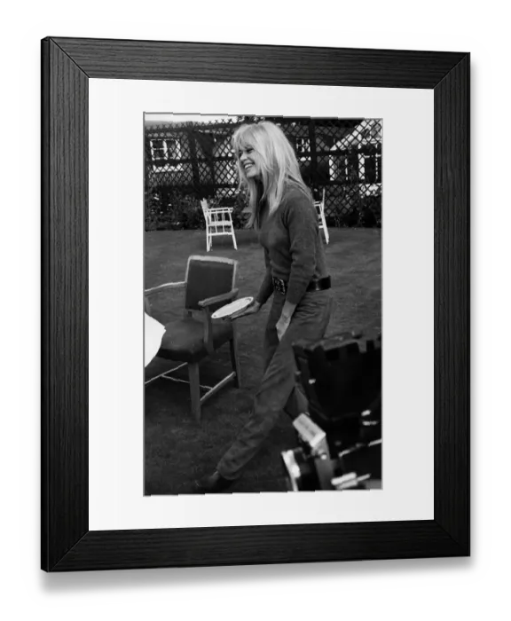Framed Print : Brigitte Bardot French actress with plate of porridge 1966 which she is Framed Print : Brigitte Bardot French actress with plate of porridge 1966 which she is