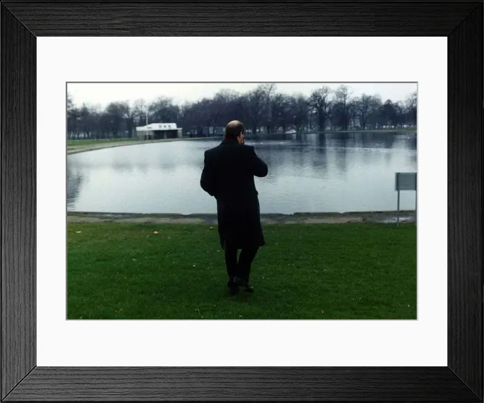 Framed Print : Gorden Kaye actor looking out over a boating lake in winter August 1989
