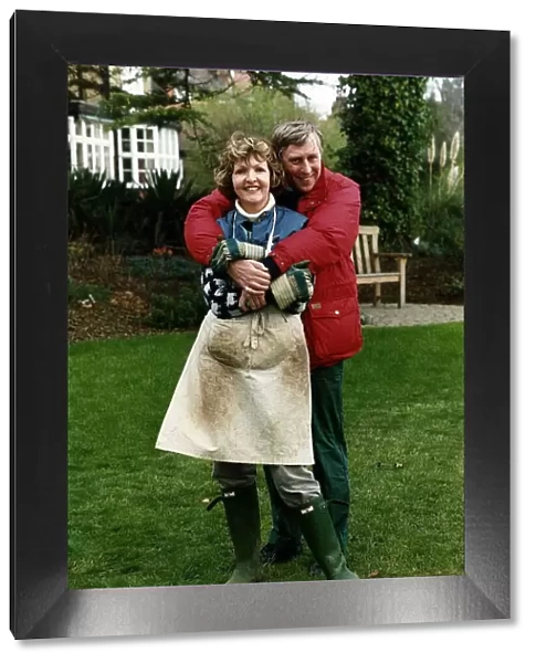 Penelope Keith actress with husband in garden. April 1989