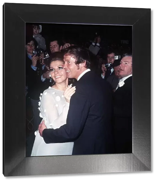Roger Moore Actor with his bride Luisa Mattioli after their wedding ceremony with their