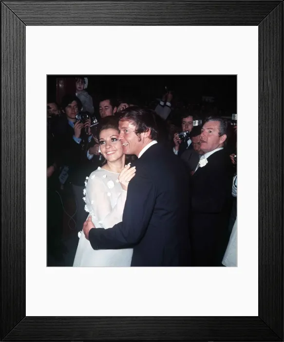 Framed Print : Roger Moore Actor with his bride Luisa Mattioli after their wedding ceremony with their Framed Print : Roger Moore Actor with his bride Luisa Mattioli after their wedding ceremony with their