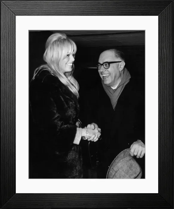 Framed Print : Carlo Ponti and Britt Ekland met waiting at the luggage bay at London Airport Framed Print : Carlo Ponti and Britt Ekland met waiting at the luggage bay at London Airport