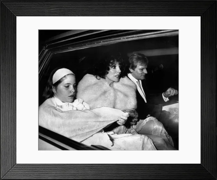 Framed Print : Joan Collins, actress, leaving a party with her family in May 1985