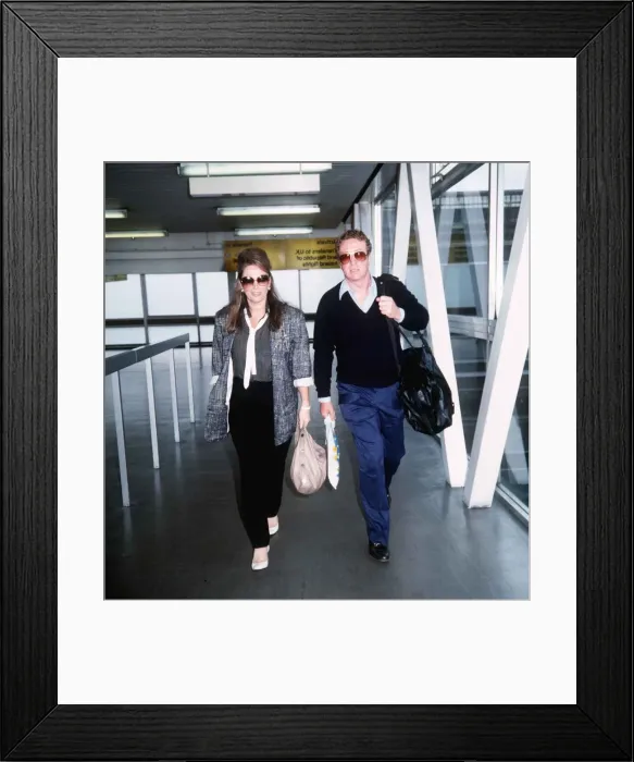Framed Print : Michael Caine and Jackie Collins on their way to Los Angeles September 1985 Framed Print : Michael Caine and Jackie Collins on their way to Los Angeles September 1985
