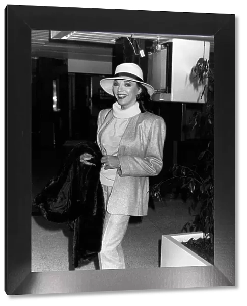 Joan Collins Actress leaving Heathrow for the South of France, December 1989