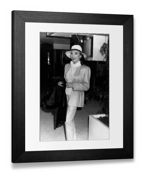 Framed Print : Joan Collins Actress leaving Heathrow for the South of France, December 1989 Framed Print : Joan Collins Actress leaving Heathrow for the South of France, December 1989