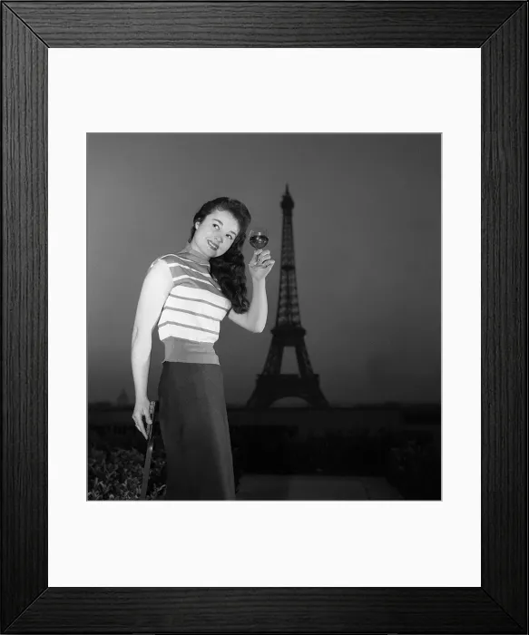 Framed Print : A model raises a glass of wine in front of the Eiffel Tower