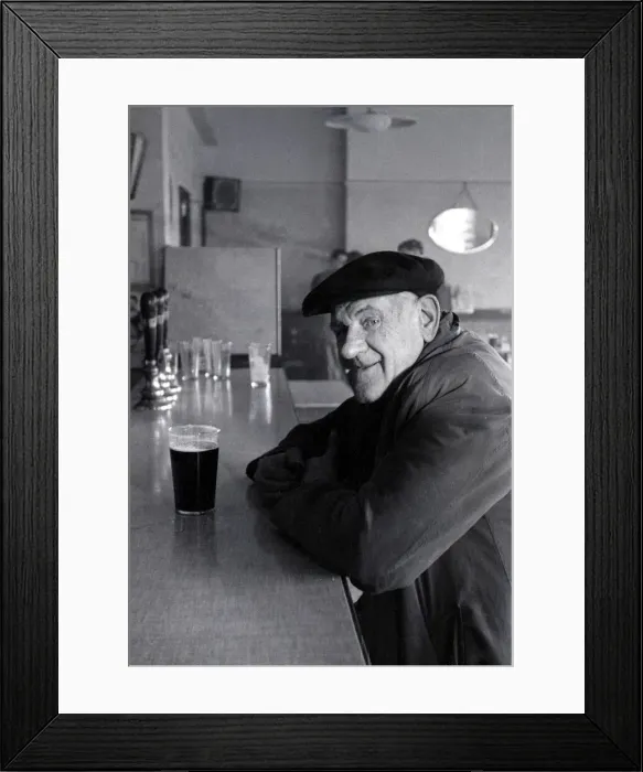 Framed Print : The Chimes Lansbury Public House Pub - 1953 A old man sits at the bar with a pint