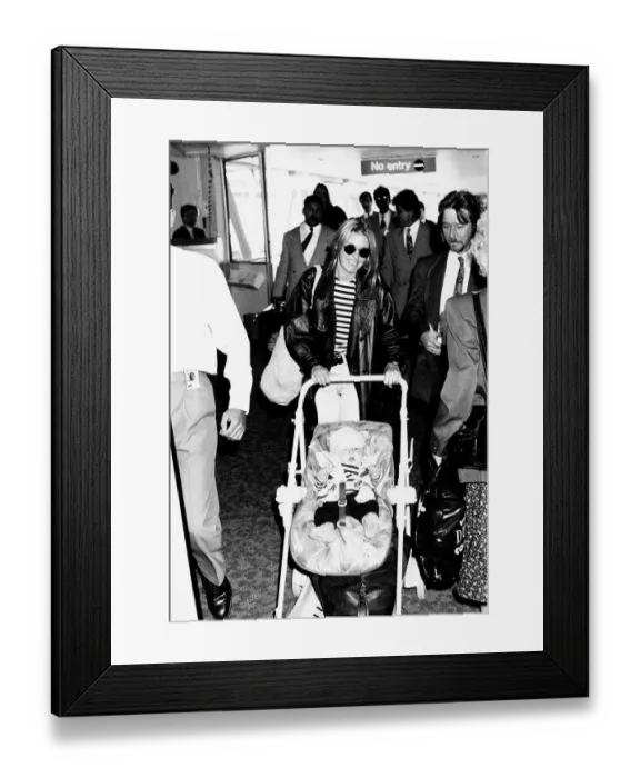 Framed Print : Patsy Kensit Actress and her son james at heathrow airport Framed Print : Patsy Kensit Actress and her son james at heathrow airport