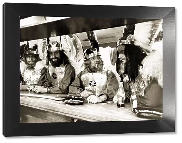 Men drinking in a pub in Knightsbridge London wearing Viking costume