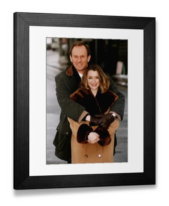 Framed Print : Peter Davison Actor in the BBC Comedy series Ain t Misbeahvin cuddles actress Lesley