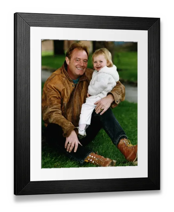 Framed Print : Bruce Jones Milkman turned Actor with eighteen month old granddaughter Sophie