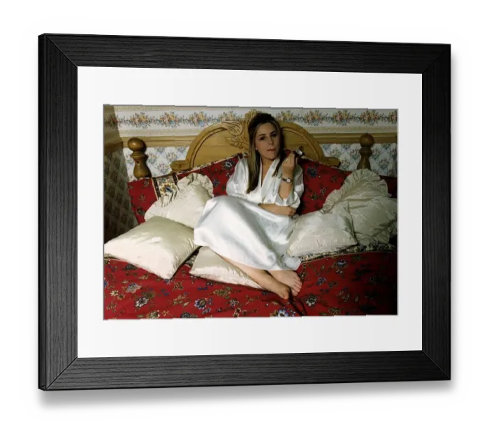 Framed Print : Melissa Bell Actress takes time out to treat herself to a Chocolate bar Laying on her Co