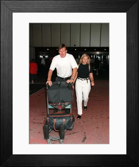 Framed Print : Nick Faldo Golf arrives at London Heathrow Airport from Montreal with girlfriend Brenna Framed Print : Nick Faldo Golf arrives at London Heathrow Airport from Montreal with girlfriend Brenna