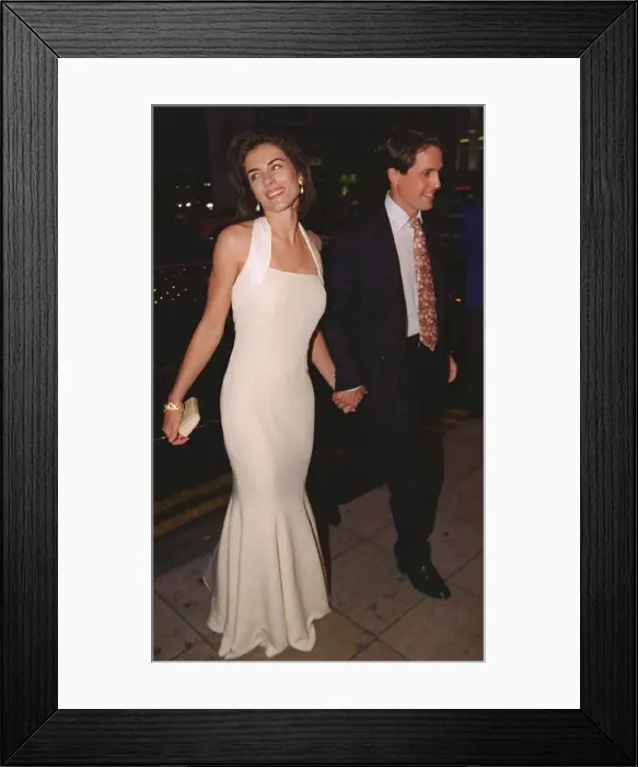 Framed Print : Elizabeth Hurley Actress and boyfriend actor Hugh Grant at the premiere of new film Framed Print : Elizabeth Hurley Actress and boyfriend actor Hugh Grant at the premiere of new film