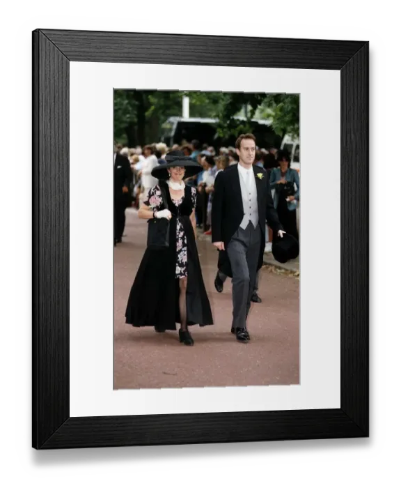 Framed Print : Angus Deayton Actor and TV Presenter with unidentified woman attends Sarah Amstrong Jones