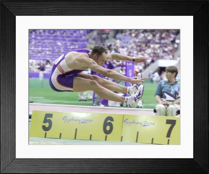 Framed Print : Dean Macey in the Decathlon Long Jump Sydney Olympic Games 2000