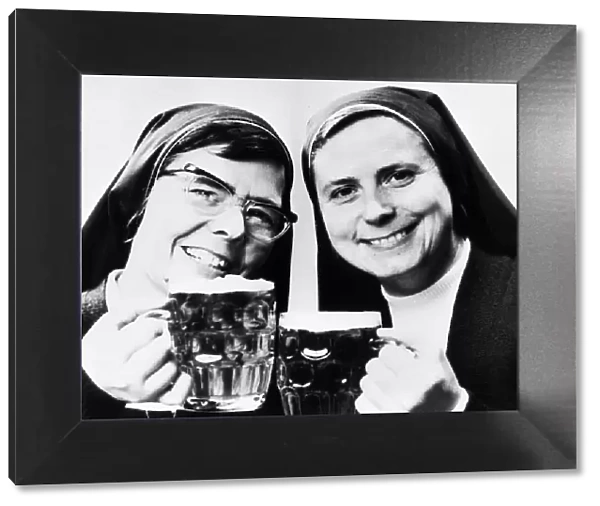 Nuns Sisters Elizabeth and Joan with pints of beer 1976