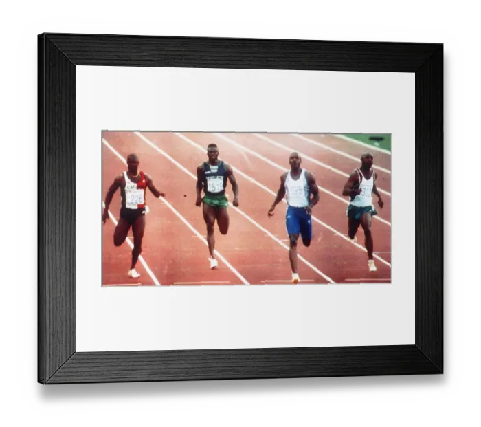 Framed Print : British athlete Linford Christie in action during the Mens 100 Metres Quarter Final heat