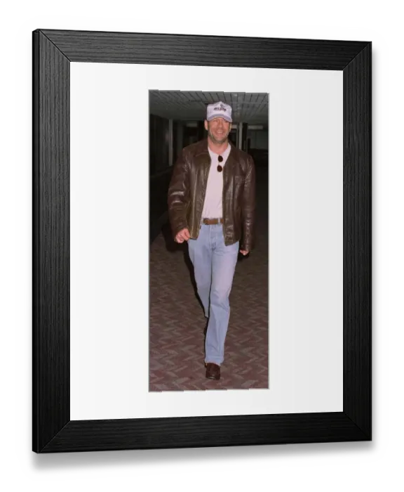 Framed Print : Actor Bruce Willis arrives at Heathrow from New York on Concorde