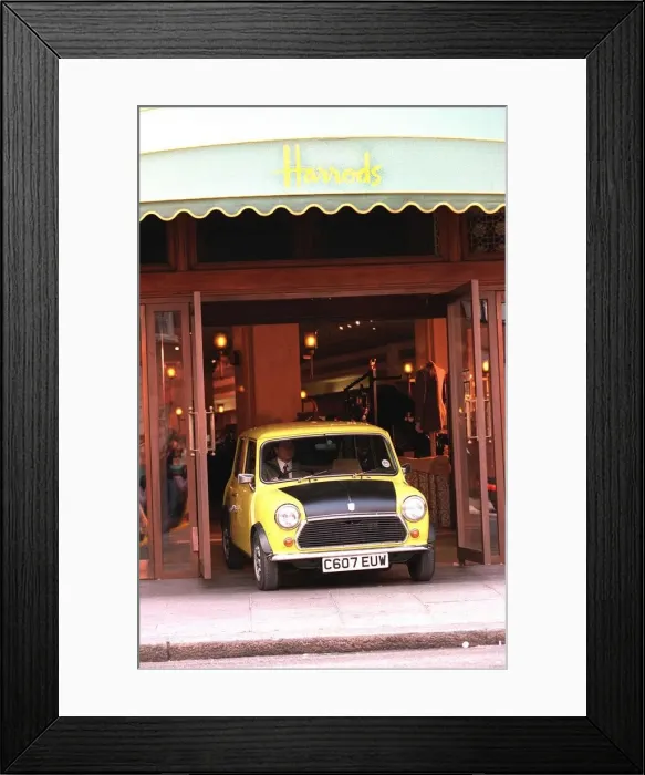 Framed Print : Rowan Atkinson Actor as Mr Bean filming at Harrods - motor cars mini