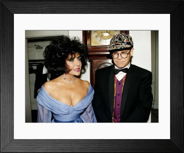 Framed Print : Elizabeth Taylor and Elton John together at a charity function for AIDS at Lodons Framed Print : Elizabeth Taylor and Elton John together at a charity function for AIDS at Lodons