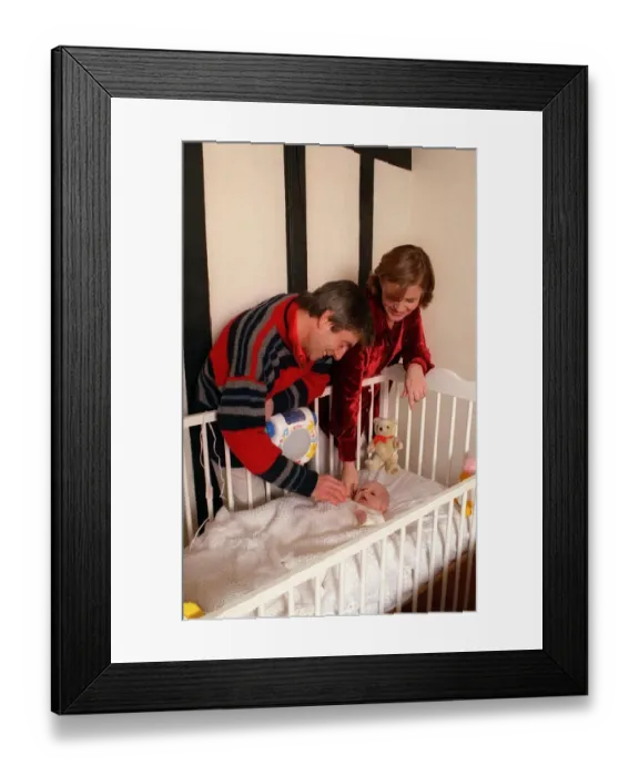 Framed Print : Melvin Hayes actor with fiancee and baby daughter Lily in cot family Framed Print : Melvin Hayes actor with fiancee and baby daughter Lily in cot family