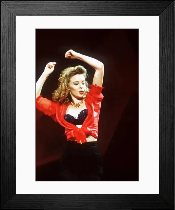 Framed Print : Kylie Minogue actress & singer on stage with arms in air Framed Print : Kylie Minogue actress & singer on stage with arms in air