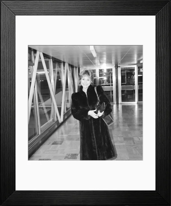 Framed Print : Actress Felicity Kendal at Heathrow Airport, February 1984 Framed Print : Actress Felicity Kendal at Heathrow Airport, February 1984