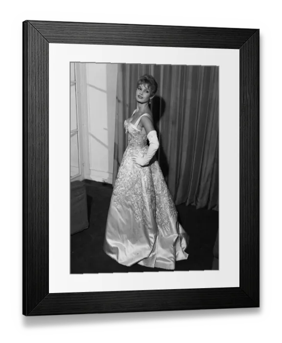 Framed Print : French actress Bridgitte Bardot rehearses her curtsy in anticipation of her meeting with