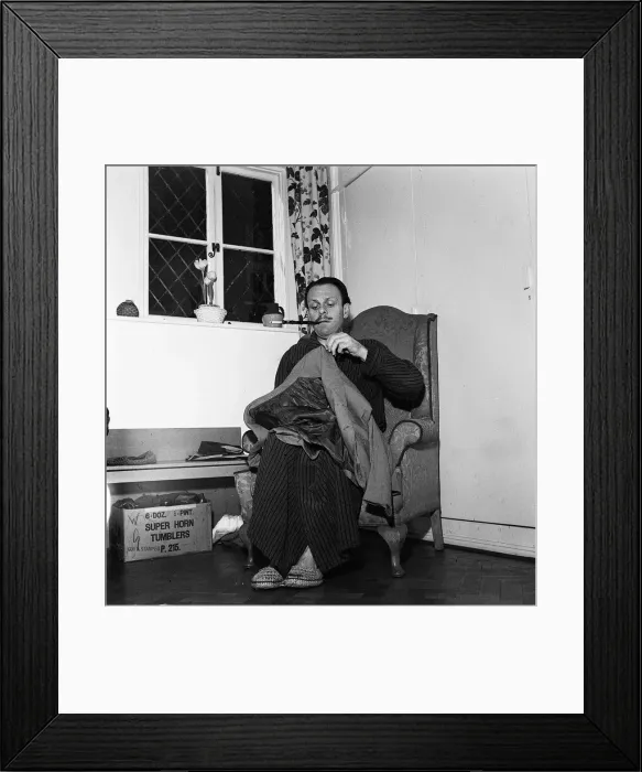 Framed Print : Actor Terry Thomas sitting at home sewing his coat February 1957 Framed Print : Actor Terry Thomas sitting at home sewing his coat February 1957