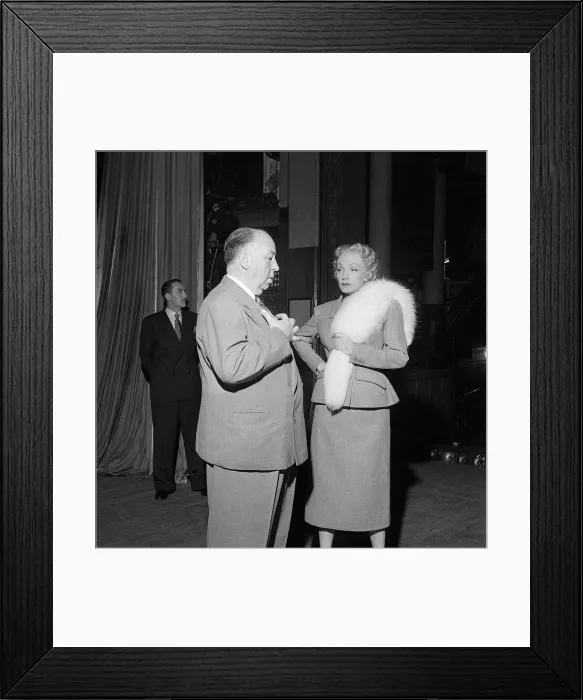 Framed Print : Film director Alfred Hitchcock and Marlene Dietrich On the set of Stage Fright