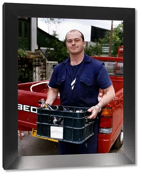 Ross Kemp Actor of Eastenders on the Set with a Crate of empty Beer Bottles