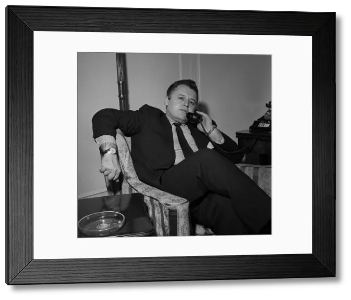 Framed Print : Actor Rod Steiger in London talking on the phone in his hotel room December Framed Print : Actor Rod Steiger in London talking on the phone in his hotel room December