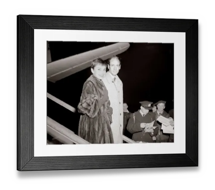 Framed Print : Actress Audrey Hepburn arrives in London Airport with husband December 1954 Framed Print : Actress Audrey Hepburn arrives in London Airport with husband December 1954