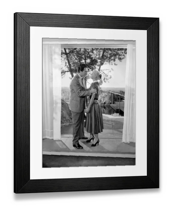 Framed Print : Ginger Rogers with husband Jacques Bergerac in a scene from the the film Lifetime