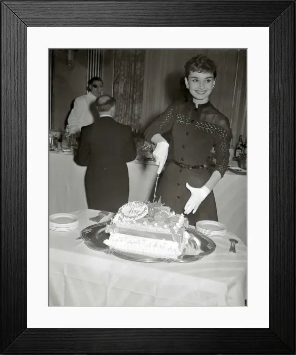 Framed Print : Audrey Hepburn May 1953 Film actress cuts into her Welcome home cake