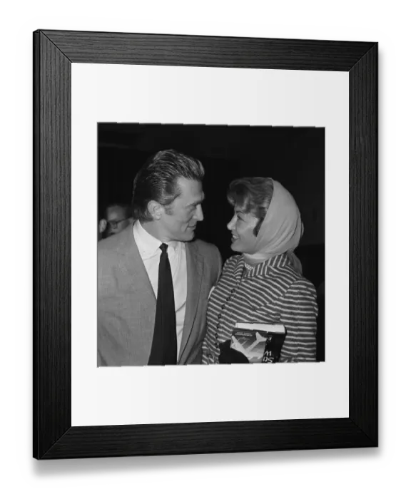 Framed Print : Actor Kirk Douglas at London Airport with his wife August 1958 Framed Print : Actor Kirk Douglas at London Airport with his wife August 1958