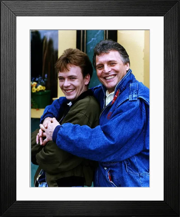 Framed Print : Adam Woodyatt who stars in Eastenders as Ian Beale, poses with Peter Deane who plays his