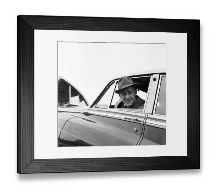 Framed Print : Actor Alec Guinness loading his Bently onto an aircraft bound for France where he will