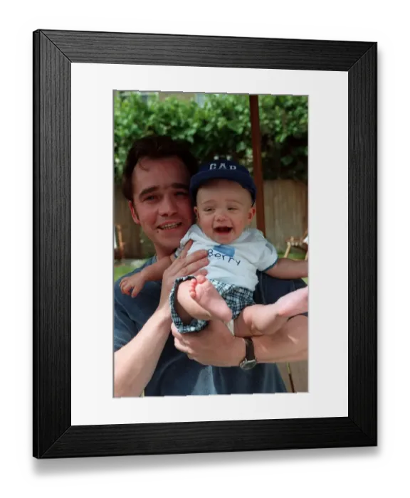 Framed Print : Actor Todd Carty with baby son James at home June 1997 Framed Print : Actor Todd Carty with baby son James at home June 1997