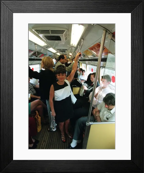 Framed Print : Maria Smedley actress standing on underground train holding on to hand rail Framed Print : Maria Smedley actress standing on underground train holding on to hand rail