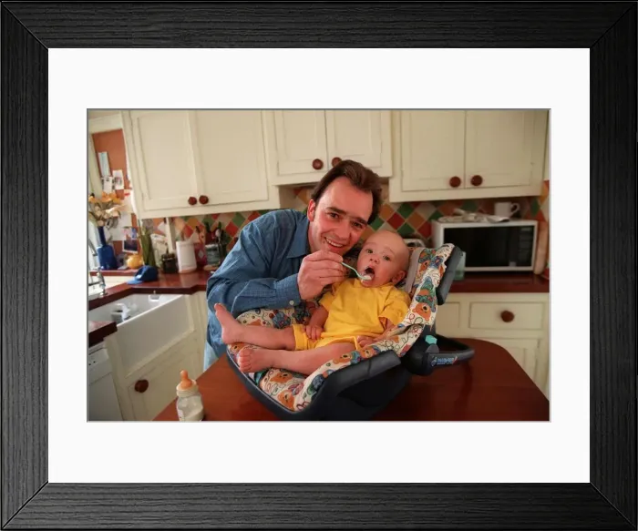 Framed Print : Actor Todd Carty at home with baby son James, June 1997 Framed Print : Actor Todd Carty at home with baby son James, June 1997