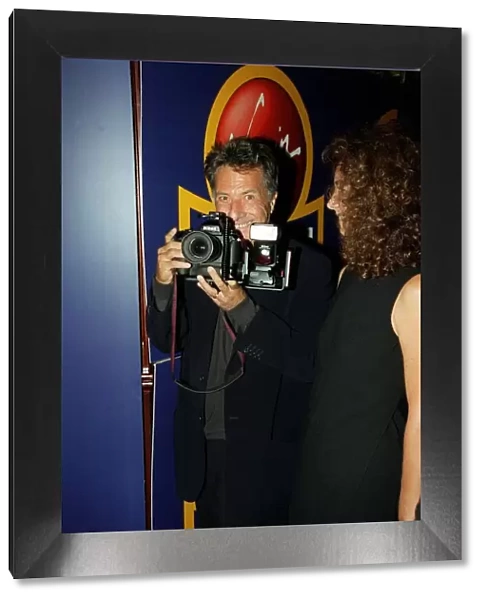 Dustin Hoffman Actor August 98 Holding a camera at the premiere of Lock Stock And