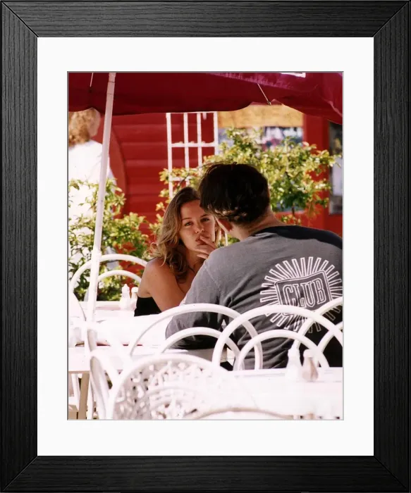 Framed Print : Kylie Minogue Singer Actress seated outside in a London Cafe