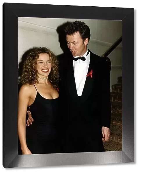 Kylie Minogue Australian singer and Actress with singer Paul Young Showing cleavage