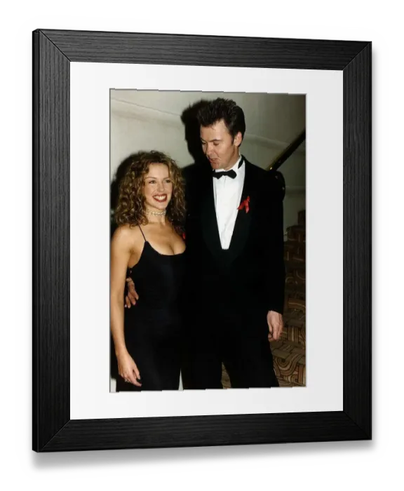 Framed Print : Kylie Minogue Australian singer and Actress with singer Paul Young Showing cleavage