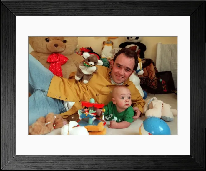Framed Print : Actor Todd carty at home with baby son James, June 1997